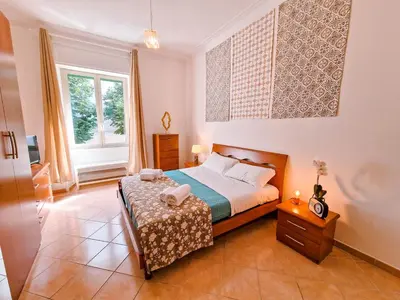 a bedroom with a bed and a window at Vatican Shelter in Rome