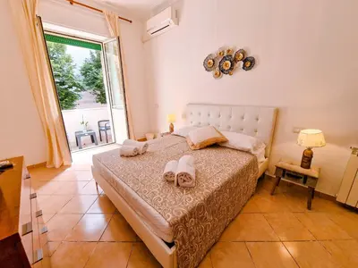 a bedroom with a bed and a large window at Vatican Shelter in Rome