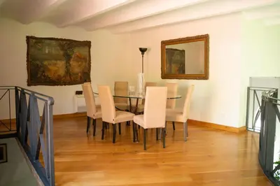 a dining room with a table and chairs at Villa Terme di Caracalla with private Swimming Pool in Rome