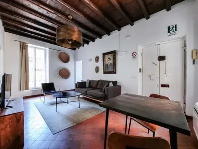 a living room with a couch and a table at EasyTopStay - Cosy Flat near Castel S Angelo in Rome