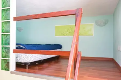 a bunk bed in a room with a ladder at Holiday House Esedra in Rome