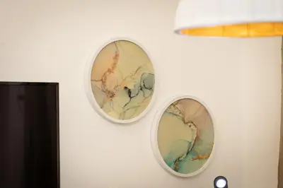 two plates hanging on a wall at SolferinoNove in Rome