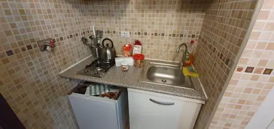 a kitchen with a sink and a counter top at Holiday City Centre in Rome