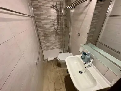a bathroom with a sink and a shower and a toilet at Cozy apartment in Rome Trastevere in Rome