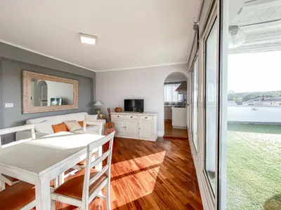 a bedroom with a bed and a table and a window at Al 13 - La Terrazza in Rome