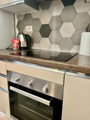 a kitchen with a stove top oven in a kitchen at Dreams in Rome Vaticano - Metro A in Rome