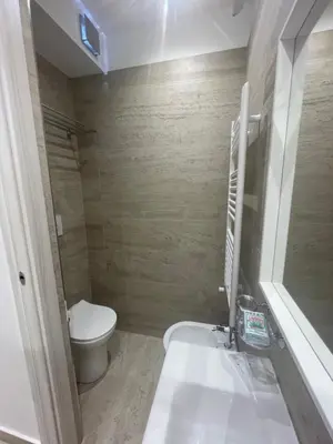a small bathroom with a toilet and a sink at Bobbio Holiday Rome in Rome