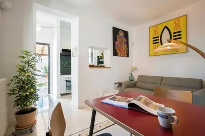 a living room with a table and a couch at Giardino al 9 in Rome