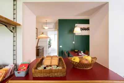 a table with two baskets of bread and fruit on it at Giardino al 9 in Rome