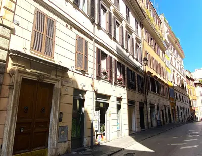 an old building on a street in a city at Terraces under the Moon in Rome