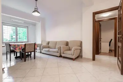 a living room with a couch and a table at Roma SanPaolo Apartment in Rome