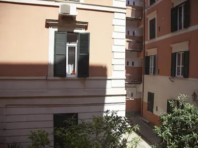 a building with a window with a shutter at Apartment Testaccio Piramide by Interhome in Rome