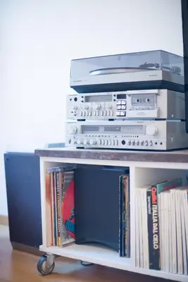 a shelf with a dvd player and other electronics on it at ROMA your home in trastevere e gianicolo in Rome
