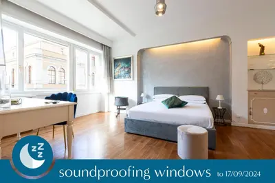 a bedroom with a bed and a sink and a desk at Comfortable Dream Apartment Piazza del Popolo in Rome