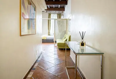 a bedroom with a bed and a fireplace at Vittoria House in Rome
