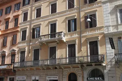 a large building with balconies on the side of it at Corso Grand Suite in Rome