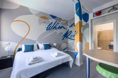 a bedroom with a bed and a wall with a basketball mural at MHouse Roma in Rome