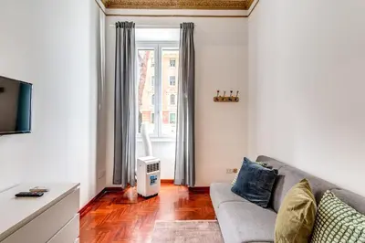 a living room with a couch and a window at Corso Trieste 62 in Rome