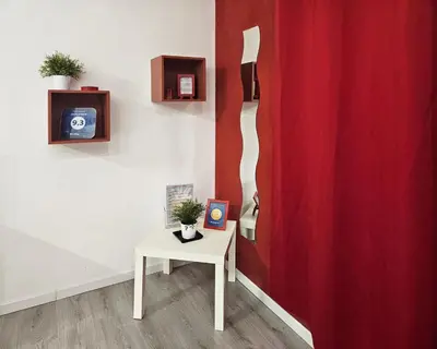 a room with a table and a red curtain at APT Re di Roma in Rome