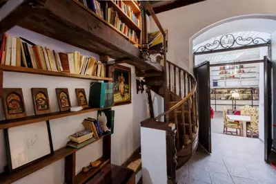 a hallway with wooden shelves with books at Navona Glamour Apartment in Rome