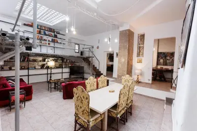 a living room with a table and chairs at Navona Glamour Apartment in Rome