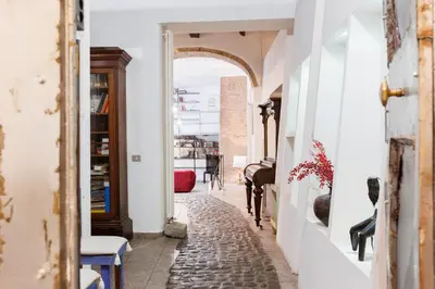 a hallway with an archway in a house at Navona Glamour Apartment in Rome