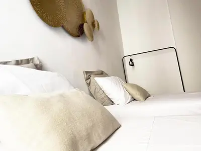 a bedroom with two beds and a mirror on the wall at Appartamento a due passi da San Pietro, Vaticano in Rome