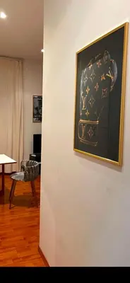 a painting on a wall in a living room at PARIOLI LUXURY HoME in Rome