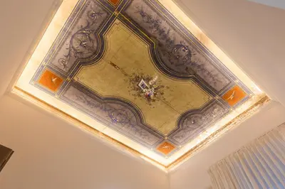 an ornate coffered ceiling in a room at Cavour LR Collection in Rome