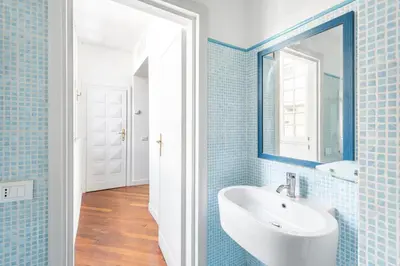 a bathroom with a sink and a mirror at Relais Quinto Piano in Rome