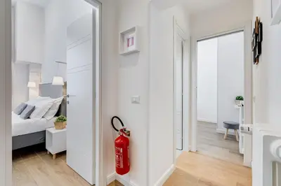 a bedroom with a fire hydrant next to a bed at Colonna Luxury Apartment in Rome