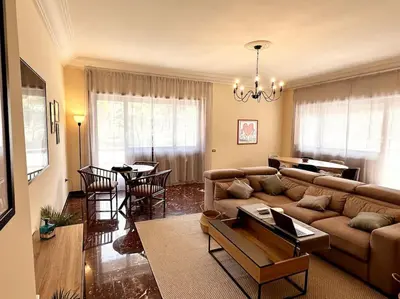 a living room with a couch and a table at Luxurious flat close to the Vatican/metro in Rome