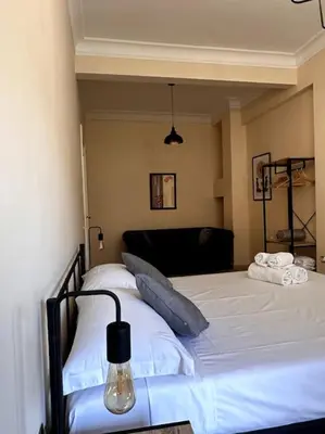 a bedroom with a large white bed in a room at Luxurious flat close to the Vatican/metro in Rome
