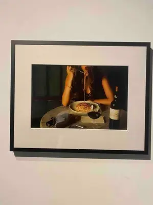 a picture of a woman taking a picture of a pizza at Casa Annamaria al Pantheon in Rome
