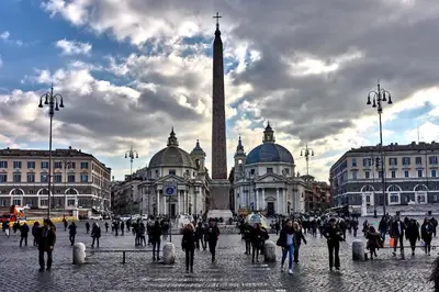 a group of people walking in front of a building at Magenta Collection Terrione 25 in Rome