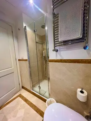 a bathroom with a glass shower and a toilet at Circo Massimo Sweet Home - next to FAO in Rome