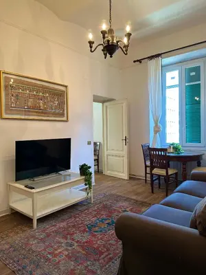 a living room with a large flat screen tv at La casetta a monti in Rome