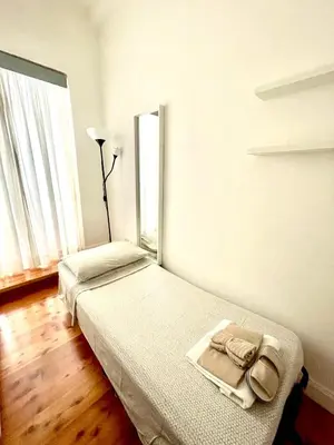 a bedroom with two beds and a window at Domus Montebello in Rome