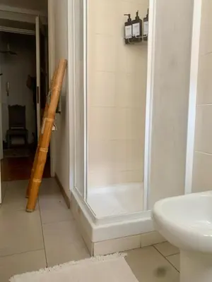 a shower in a bathroom with a toilet and a sink at d-cube camera Colosseo in Rome