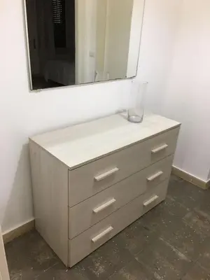 a dresser with a mirror on top of it at casa di lella ai musei vaticani in Rome