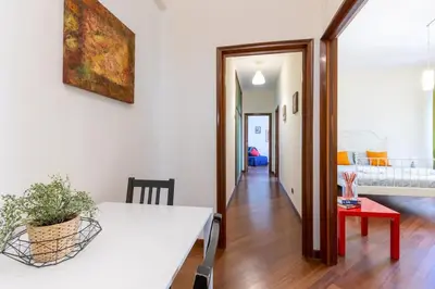 a living room with a white table and a dining room at 2 Vatican St Peter's Daniele apartment Barone in Rome