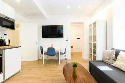 a living room with a couch and a table at Modern & Elegant by NDP rent in Rome