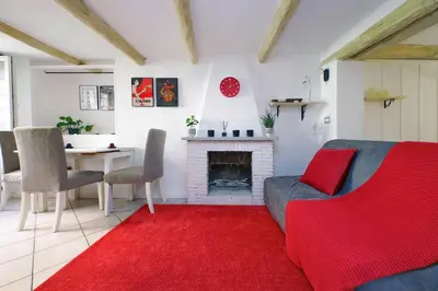 a living room with a couch and a fireplace at Al moretto in Rome
