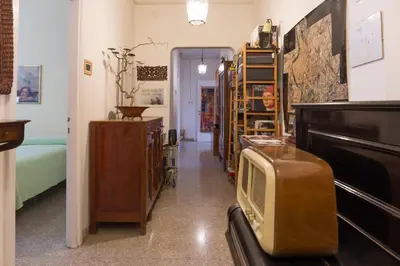 a hallway with a room with a bed and a piano at Claudia B&B in Rome
