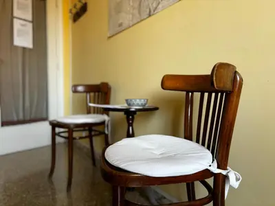 two chairs and a small table in a room at Claudia B&B in Rome