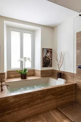 a bath tub in a bathroom with a window at Le Case di Andrea - Luxe Rome apartment in Rome