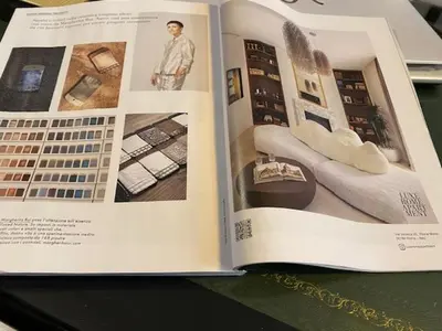 an open book with a picture of a living room at Le Case di Andrea - Luxe Rome apartment in Rome