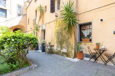 a living room with a couch and a chair at Relax Campo de' Fiori in Rome
