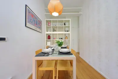 a dining room with a table with plates on it at Segneri Viale Trastevere in Rome