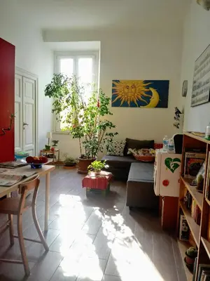 a living room with a couch and a table at Ulysses in Rome in Rome